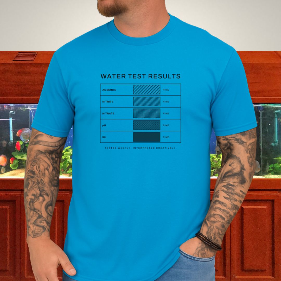 Line-art water test comparison card design (ammonia, nitrite, nitrate, pH, KH) on a tropical blue unisex t-shirt