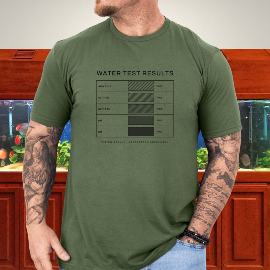 Line-art water test comparison card design (ammonia, nitrite, nitrate, pH, KH) on a heather red unisex t-shirt